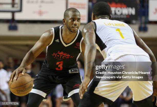 Big Tony's Chris Paul is defensed by La Flame's Kentavious Caldwell-Pope during the NBA game of James Harden charity basketball tournament at Rice...