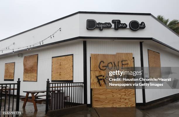 The Daiquiri Time Out on Market Street is boarded up and closed with a sign saying "Gone Fishing" for Hurricane Harvey on Friday, August 25, in...
