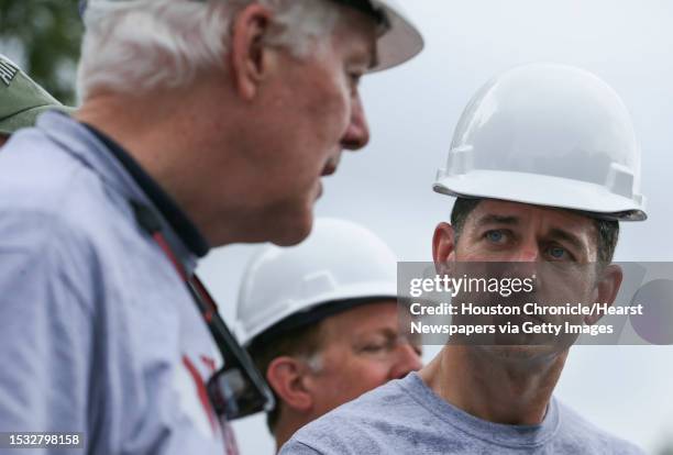 House Speaker Paul Ryan listens to Sen. John Cornyn talking to the press about Hurricane Harvey and disaster relief with a group of Congressional...