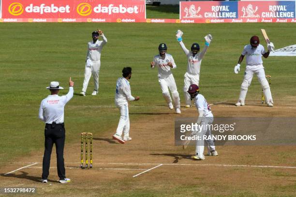 Raymon Reifer of West Indies dismissed by Ravindra Jadeja of India during day three of the First Test between West Indies and India at Windsor Park...