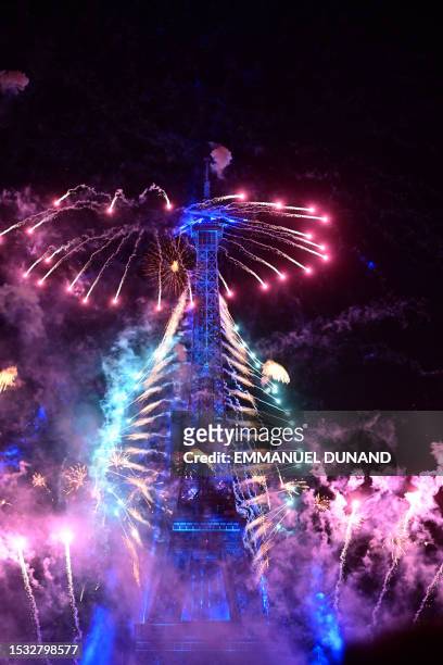 Fireworks explode above the Eiffel Tower as part of the annual Bastille Day celebrations in Paris, on July 14, 2023.