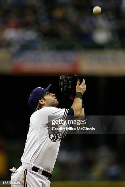 Taylor Green of the Milwaukee Brewers makes the catch in the infield to retire Mark Kotsay of the San Diego Padres during the top of the second...