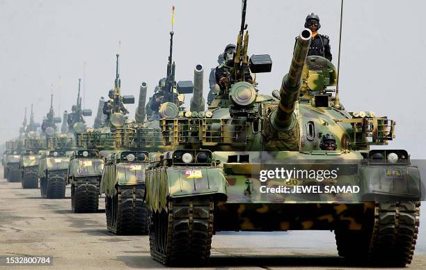 Bangladesh's Army T-69 tanks parade during a ceremony to mark the country's 33rd Independence Day in Dhaka, 26 March 2003. Bangladesh became...