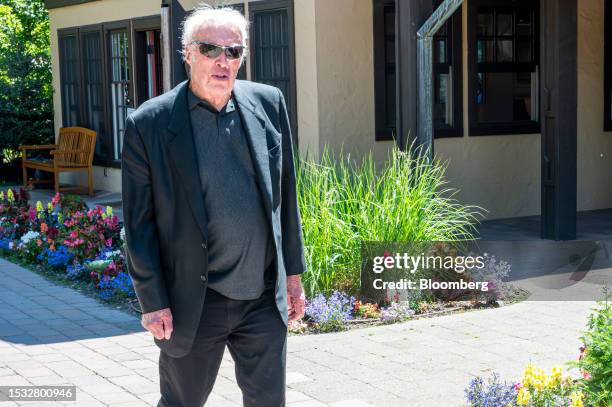 Phil Knight, chairman emeritus and co-founder of Nike Inc., walks the grounds during the Allen & Co. Media and Technology Conference in Sun Valley,...