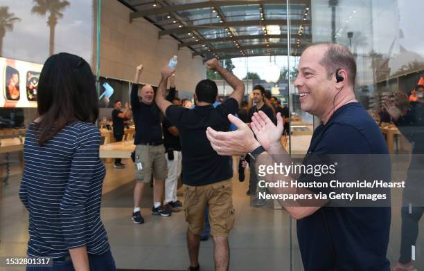 The Highland Village Apple store welcomes early customers to purchase new poducts at 8 a.m. On Friday, Sept. 21 in Houston. Stofferahn had been...
