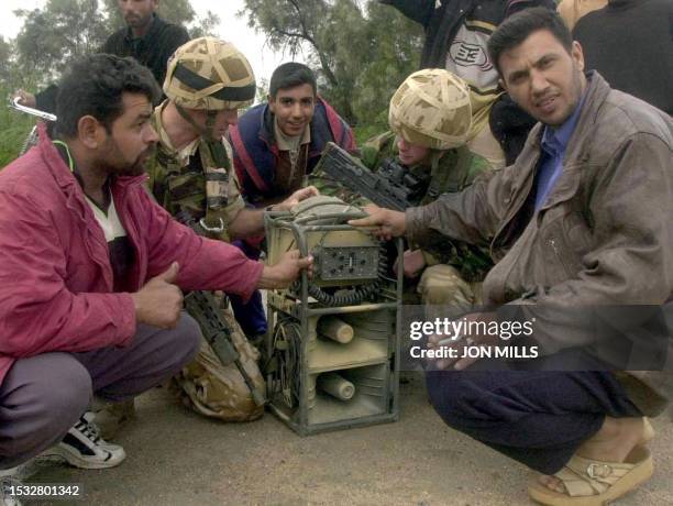 British 42 Commando PsyOps team at work in Umm Qasr, Southern Iraq, 26 March 2003. The PsyOps team are used to win the hearts and minds of Iraqi...