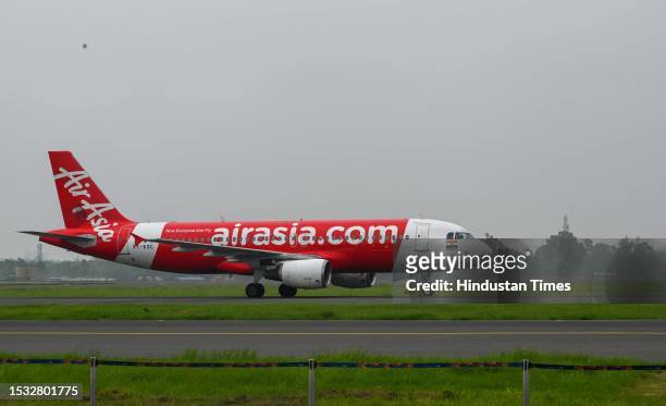An Air Asia plane takes off from the newly inaugurated fourth runway of Delhi Airport after being inaugurated by Jyotiraditya Scindia, Minister of...