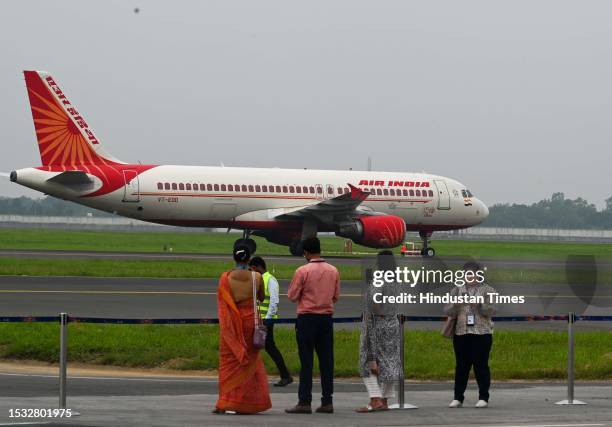 People takes selfie as an Air India Airplane takes off from the newly Inaugurated Fourth Runway of Delhi Airport after being inaugurated by...