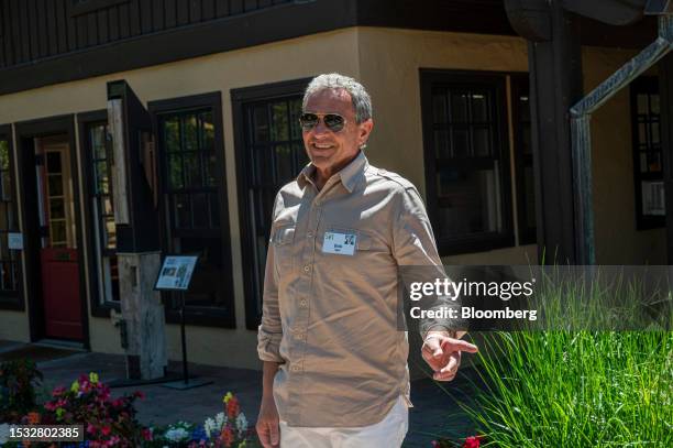 Bob Iger, chief executive officer of The Walt Disney Co., walks the grounds during the Allen & Co. Media and Technology Conference in Sun Valley,...