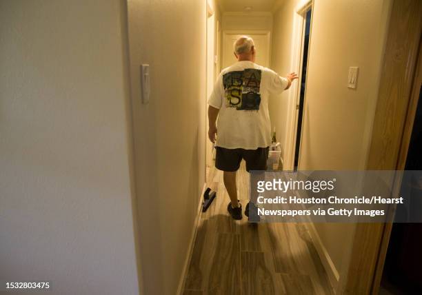 James Besch walks in his house got damaged by Tropical Storm Imelda flood water in the Castlewood subdivision on Monday, Sept. 23 in Houston. Besch...