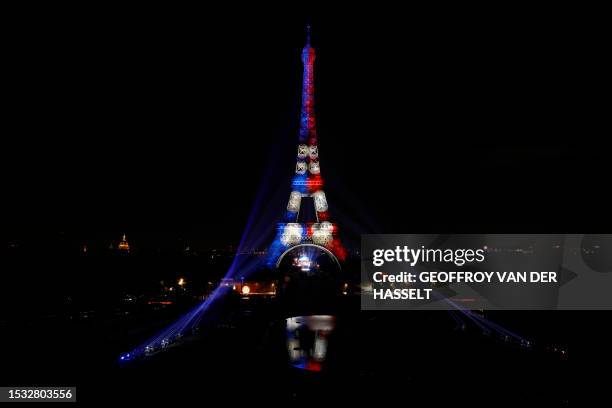 This photograph taken on July 14 shows the Eiffel Tower illumated to the colours of the French flag as part of the annual Bastille Day celebrations...