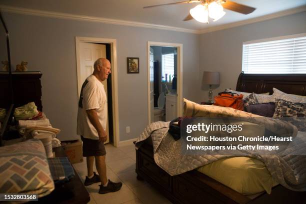 James Besch goes through the master bedroom filled with brand new furnitures in his house that got damaged by Tropical Storm Imelda flood water in...