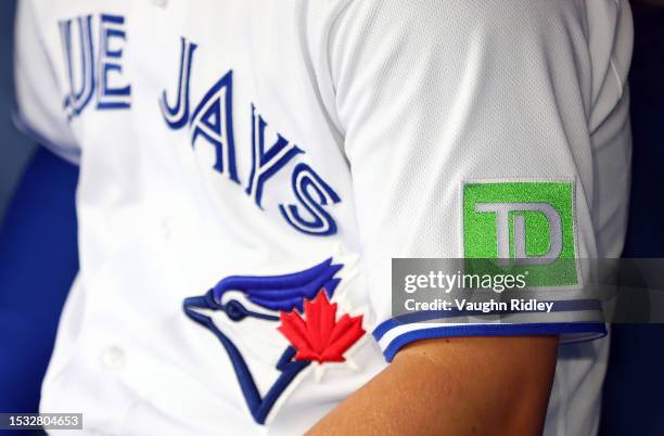 New TD Bank logo on the Toronto Blue Jays jerseys during a game against the Arizona Diamondbacks at Rogers Centre on July 14, 2023 in Toronto,...