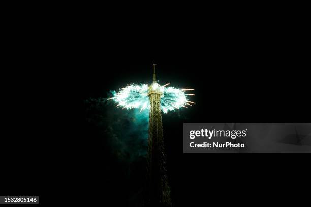 Fireworks explode above the Eiffel Tower as part of the annual Bastille Day celebrations in Paris, on July 14, 2023.