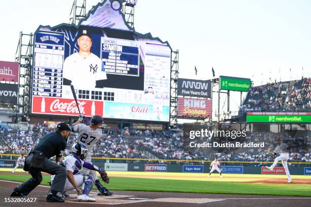 Giancarlo Stanton of the New York Yankees hits a first-inning two-run home run off of Austin Gomber of the Colorado Rockies in the game at Coors...