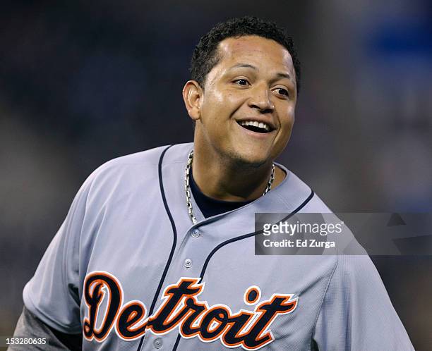 Miguel Cabrera of the Detroit Tigers smiles as he stands on first after hitting a two-run single against the Kansas City Royals in the third inning...