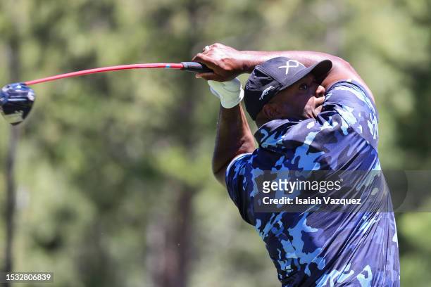 Former NFL player Dwight Freeney plays his shot on the 18th hole on Day One of the 2023 American Century Championship at Edgewood Tahoe Golf Course...