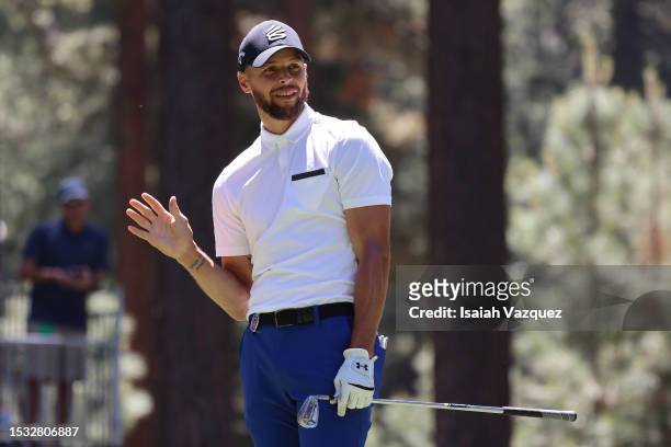 Stephen Curry of NBA Golden State Warriors waves after his tee shot on the 16th hole on Day One of the 2023 American Century Championship at Edgewood...