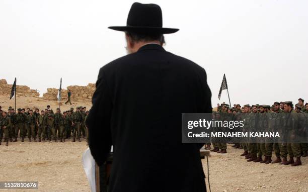 Israeli soldiers of the Ultra Orthodox battalion "Netzah Yehuda" listen to their rabbi Bar Haim at the ancient hilltop fortress of Masada in Judean...