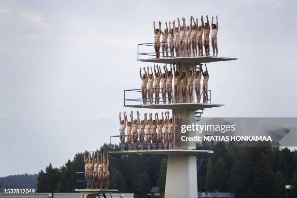 Graphic content / Volunteers pose nude for US art photographer Spencer Tunick in Kuopio, Finland, on a summer night on July 15, 2023. / Finland OUT /...