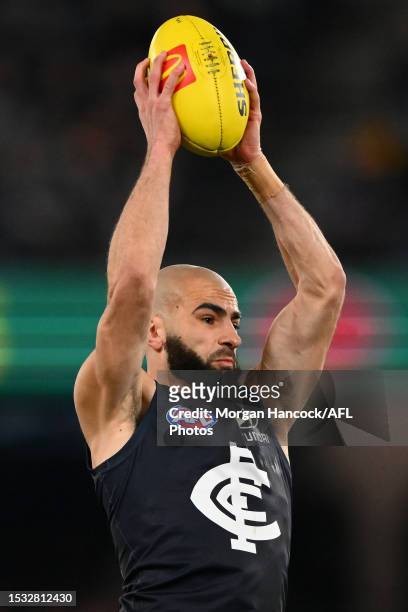 Adam Saad of the Blues marks the ball during the 2023 AFL Round 18 match between the Carlton Blues and the Port Adelaide Power at Marvel Stadium on...