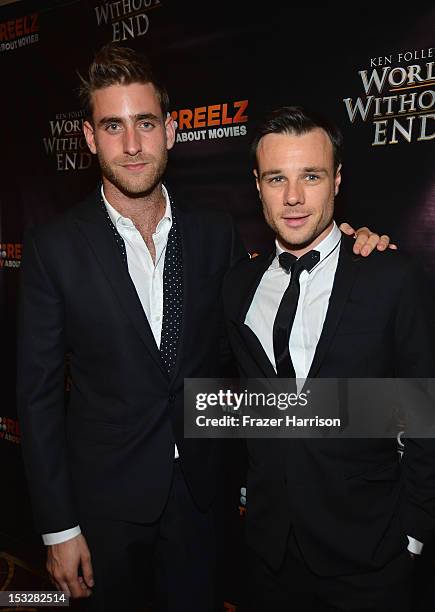 Actors Oliver Jackson-Cohen and Rupert Evans attend the screening of "World Without End" presented by ReelzChannel at The Grove on October 2, 2012 in...