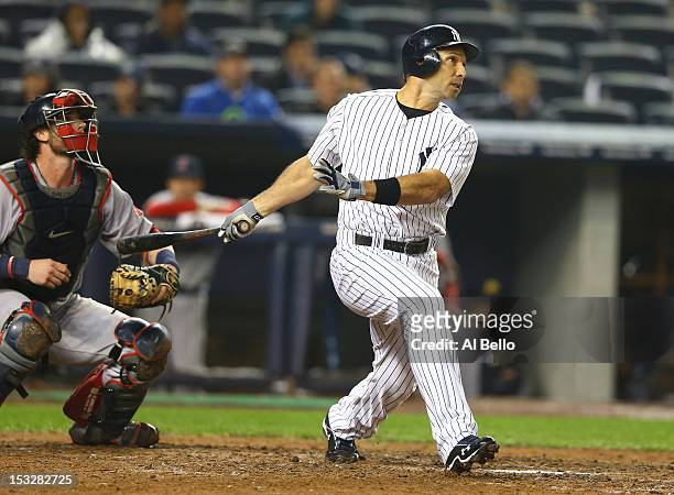 Raul Ibanez of the New York Yankees hits a game tying home run against the Boston Red Sox during their game on October 2, 2012 at Yankee Stadium in...