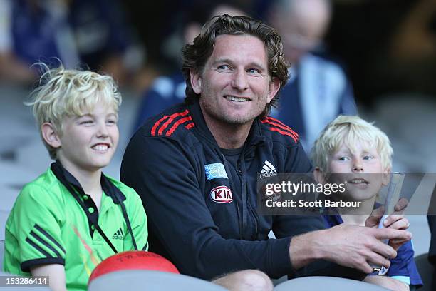 James Hird, the coach of the Essendon Bombers looks on with his sons Tom and Alex during the 2012 AFL Draft Combine at Etihad Stadium on October 3,...