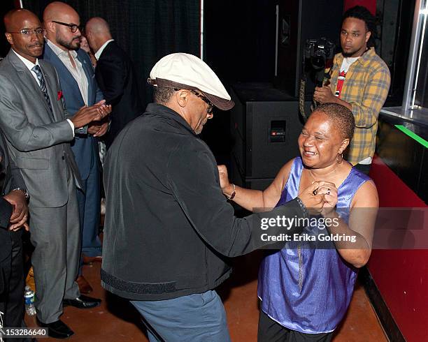 Director Spike Lee and Wild Queen Patrina Peters of the Red Hawk Hunters Marid Gras Indiand dance to the music of Hot 8 Brass Band at the "Flip the...