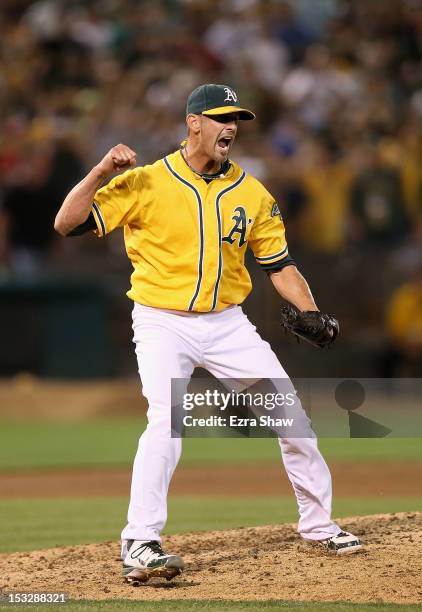 Grant Balfour of the Oakland Athletics celebrates after the Oakland Athletics beat the Texas Rangers at O.co Coliseum on October 2, 2012 in Oakland,...