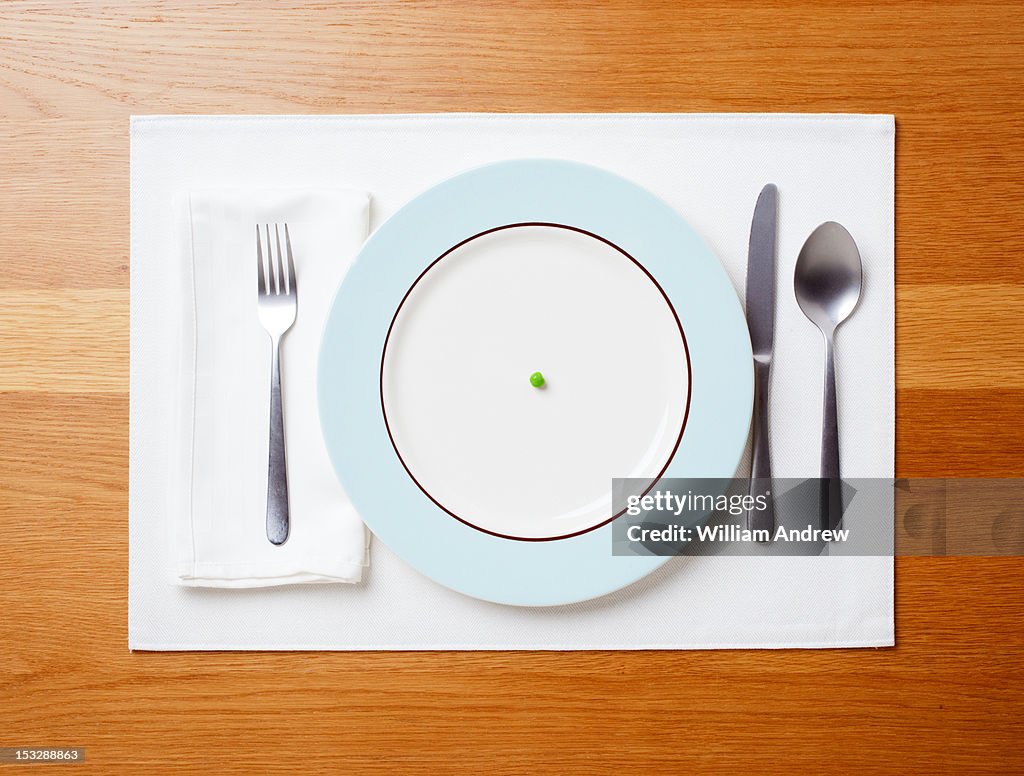 Single pea on a plate