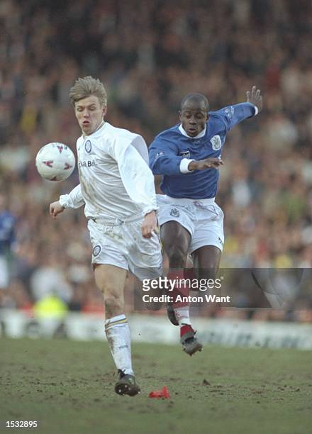 Gunner Halle of Leeds United is challenged by Paul Hall of Portsmouth during the FA Cup fifth round tie at Elland Road in Leeds. Portsmouth won the...