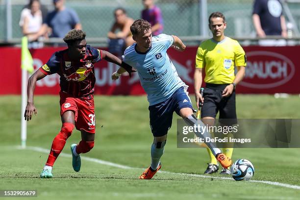 Amankwah Forson of Red Bull Salzburg and Moritz Heyer of Hamburger SV battle for the ball during the pre-season friendly match between RB Salzburg...