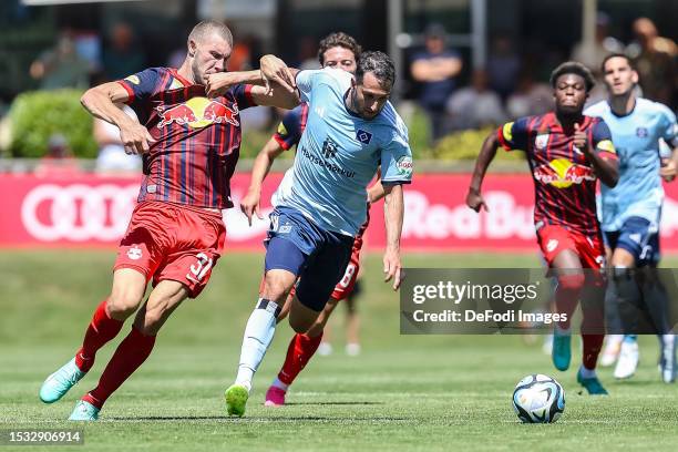 Strahinja Pavlovic of Red Bull Salzburg and Levin Oeztunali of Hamburger SV battle for the ball during the pre-season friendly match between RB...