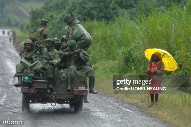 Jeep full of government soldiers passes down a road, 24 November 2007, in Rugari, near Goma. Tension is rising in the North Kivu province of eastern...