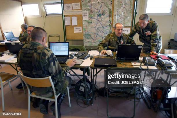 Officers from the 6th Light Armoured Brigade work on maps and computers during a battlefield digitalization exercise as part of the Phoenix 2008...