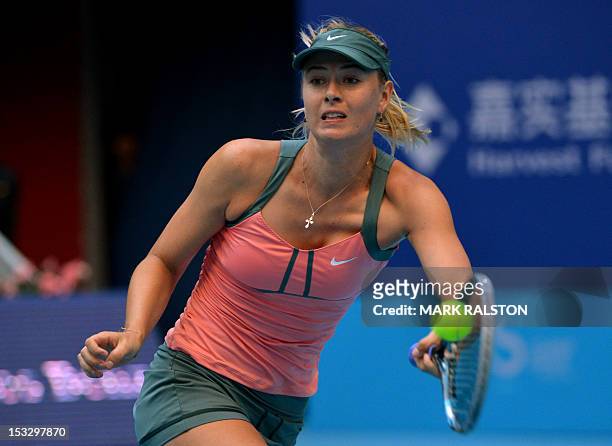 Maria Sharapova of Russia plays a lefthanded shot during during her second round women's singles match against Sorana Cirstea of Romania at the China...