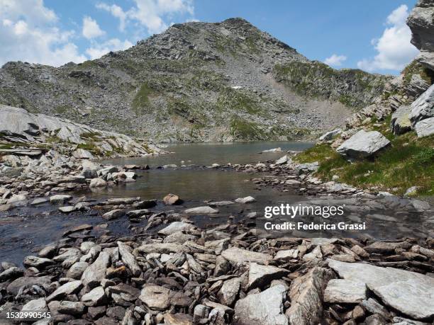 view of punta levis and laghi ghiacciati del suretta near pass da suretta and splügen pass - viamala stock pictures, royalty-free photos & images