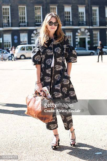 Pandora Leonard, stylist wearing Asos shoes, Marni suit, Paul Smith bag, Cutler and Gross sunglasses and a Cos top on day 5 of London Fashion Week...