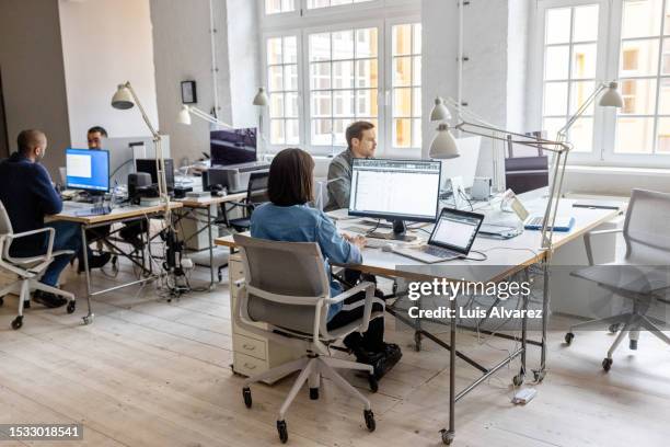 business people working in coworking office space - área sem divisões imagens e fotografias de stock