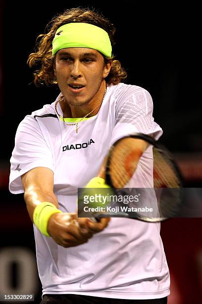 Lukas Lacko of Slovakia plays a backhand in his match against Andy Murray of Great Britain during day three of the Rakuten Open at Ariake Colosseum...