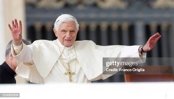 Pope Benedict XVI waves to the faithful gathered in St. Peter's square during his weekly audience on October 3, 2012 in Vatican City, Vatican. The...