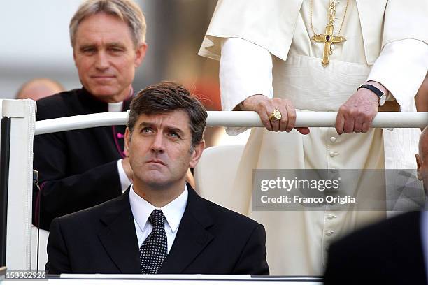 Pope Benedict XVI flanked by his personal secretary Georg Ganswein and his new butler Sandro Mariotti arrives on popemobile in St. Peter's square for...