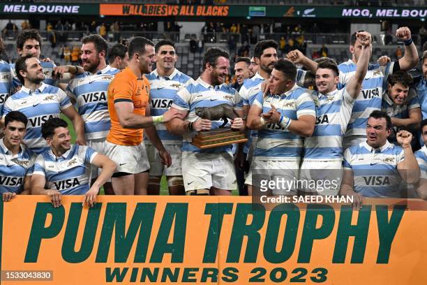 Argentina players celebrate with the Puma Trophy after defeating Australia in the Rugby Championship match between Argentina and Australia at...