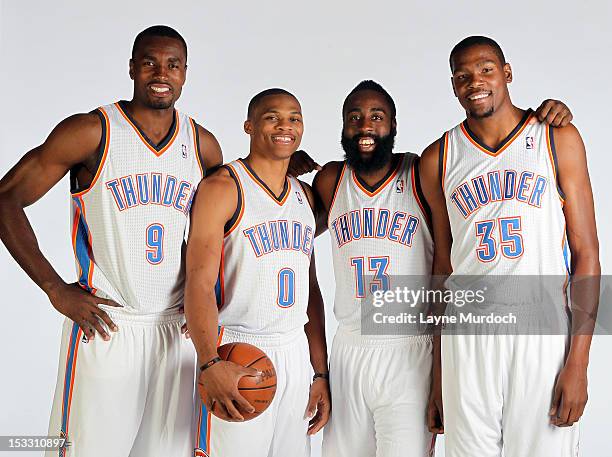 Serge Ibaka, Russell Westbrook, James Harden and Kevin Durant of the Oklahoma City Thunder pose for a portrait during 2012 NBA Media Day on October...