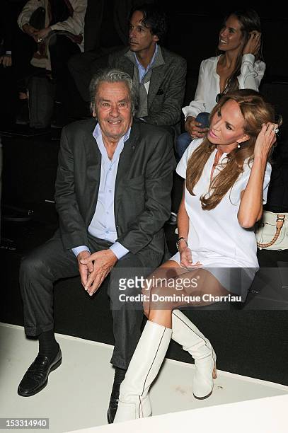 Alain Delon and Rosalie van Breemen attend the Elie Saab Spring/Summer 2013 show as part of Paris Fashion Week at Espace Ephemere Tuileries on...