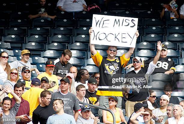 Pittsburgh Penguins fan expresses himself during the game between the Pittsburgh Pirates and the Atlanta Braves on October 3, 2012 at PNC Park in...