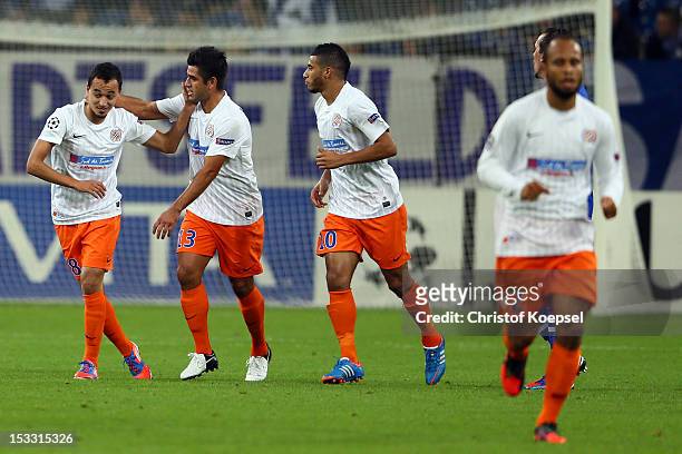 Karim Ait-Fana of Montpellier celebrates the first goal with Mapou Yanga-Mbiwa and Younes Belhanda during the UEFA Champions League group B match...