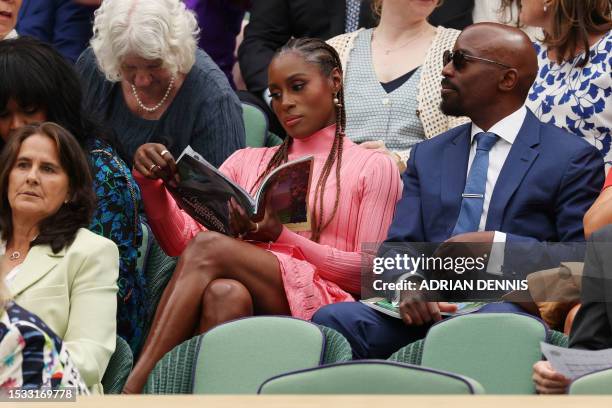 Actress Issa Rae and her husband Louis Diame attend the women's singles final tennis match between Tunisia's Ons Jabeur and Czech Republic's Marketa...