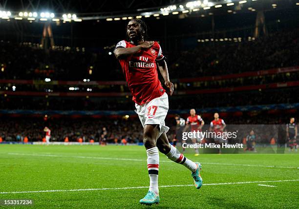 Gervinho of Arsenal celebrates after scoring the opening goal during the UEFA Champions League Group B match between Arsenal FC and Olympiacos FC at...